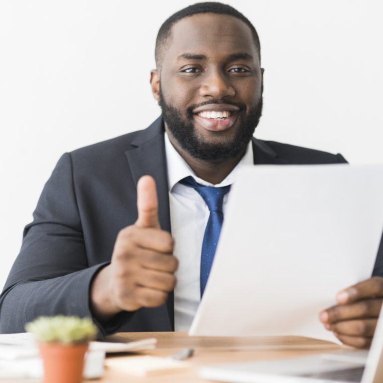 ethnic-businessman-gesturing-thumb-up